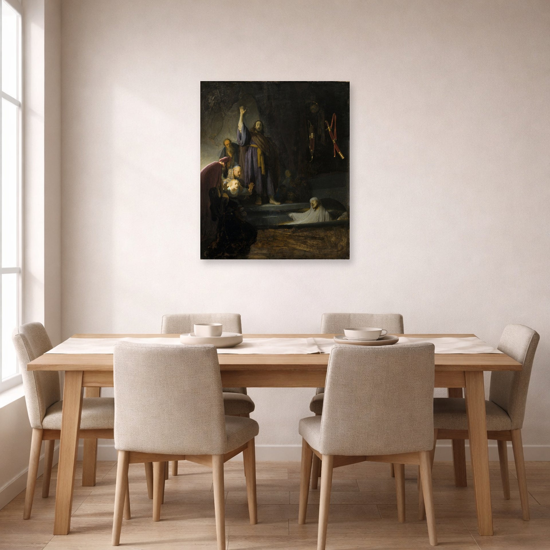 Unframed poster print of Rembrandt's The Raising of Lazarus displayed on a wall in a dining room