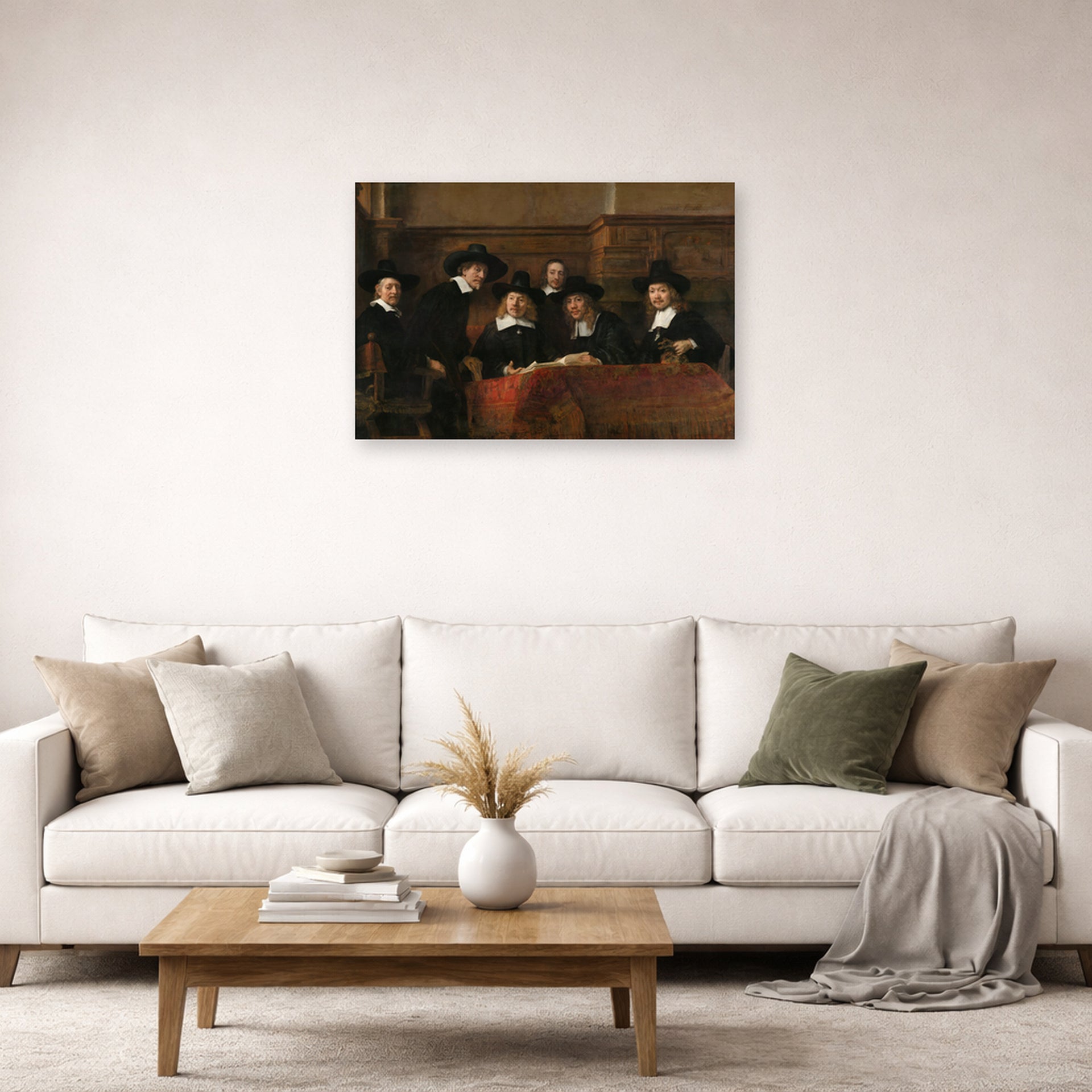 Unframed poster print of Rembrandt's The Sampling Officials displayed on a wall in a living room