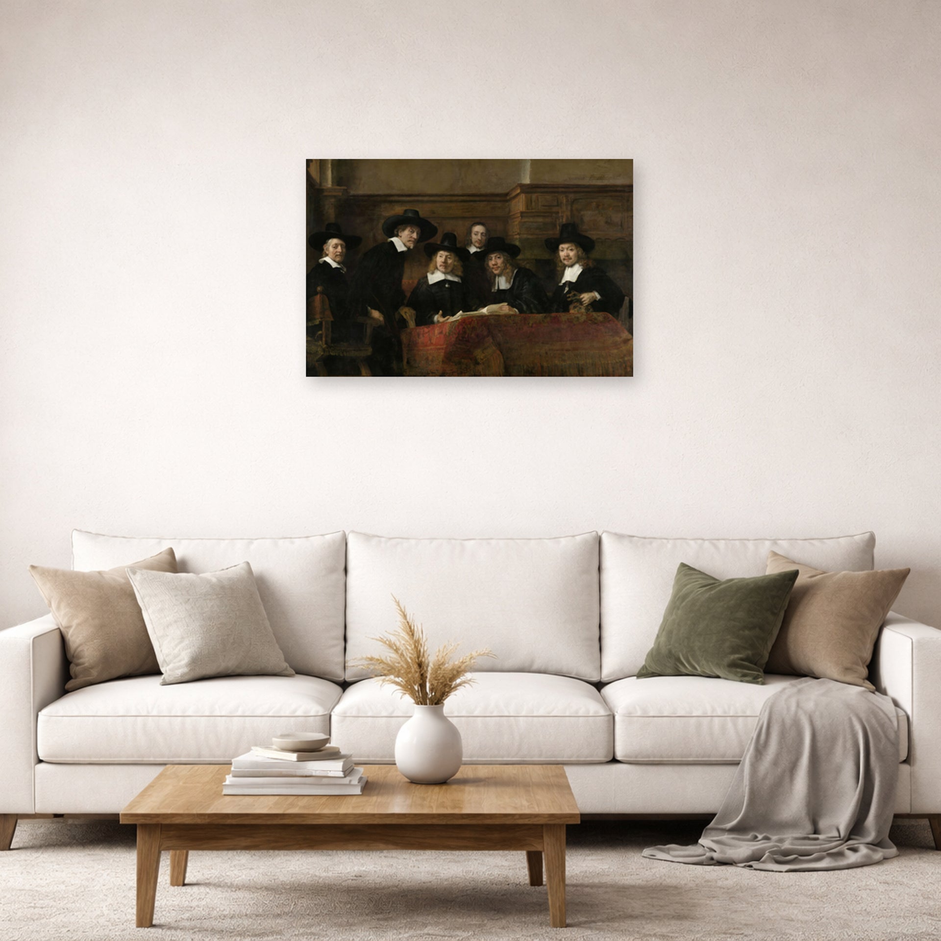 Unframed poster print of Rembrandt's The Syndics of the Clothmakers Guild displayed on a wall in a living room