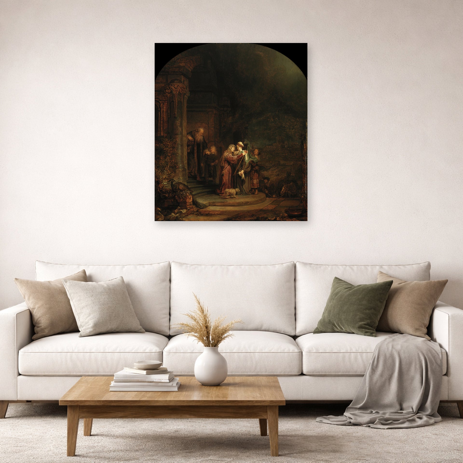 Unframed poster print of Rembrandt's The Visitation displayed on a wall in a living room