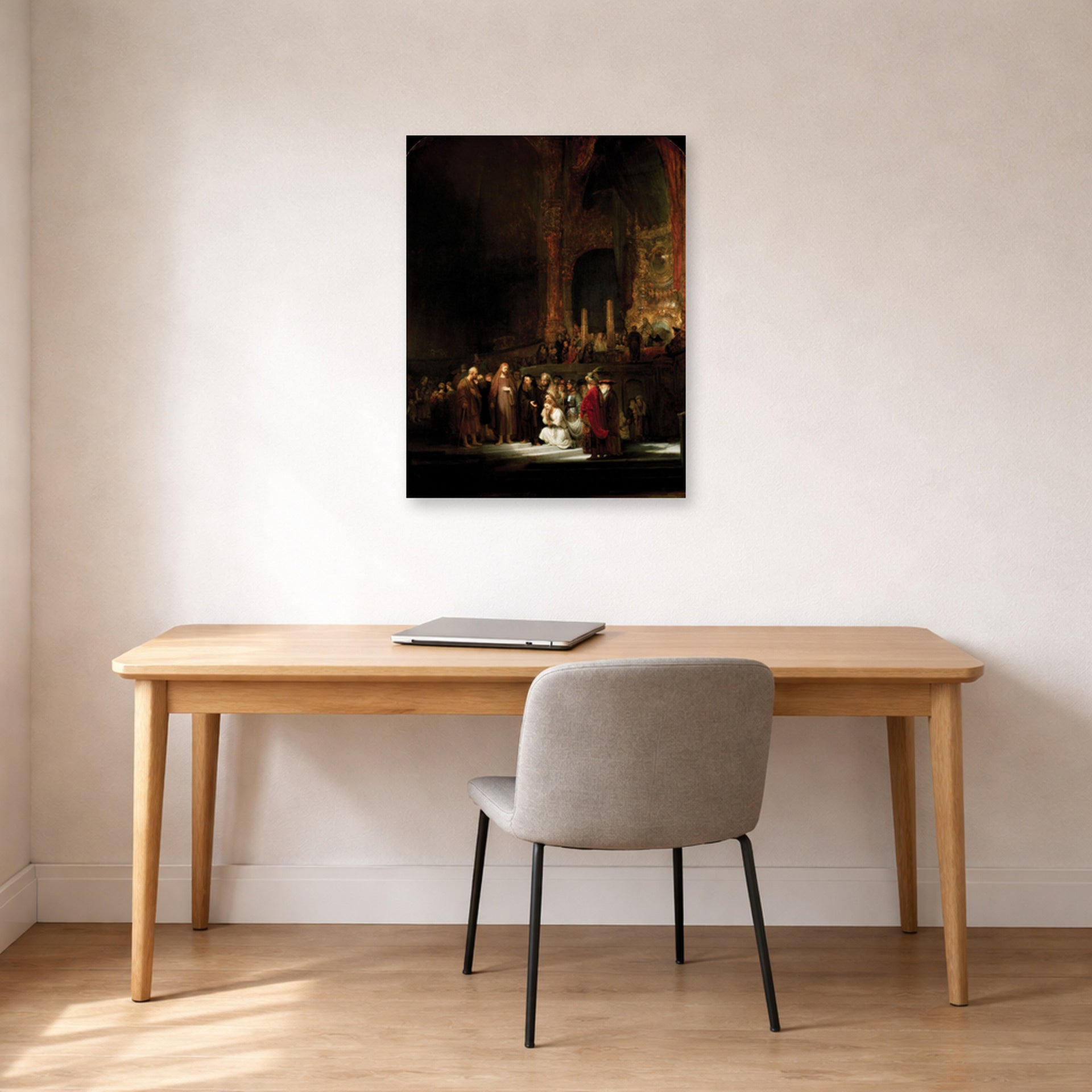 Unframed poster print of Rembrandt's The Woman Taken in Adultery displayed on a wall in an office
