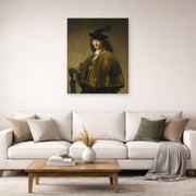 Unframed poster print of Rembrandt's Young Man with a Sword displayed on a wall in a living room