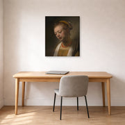 Gallery-wrapped canvas print of Rembrandt's Young Woman with a Red Necklace displayed on a wall in an office