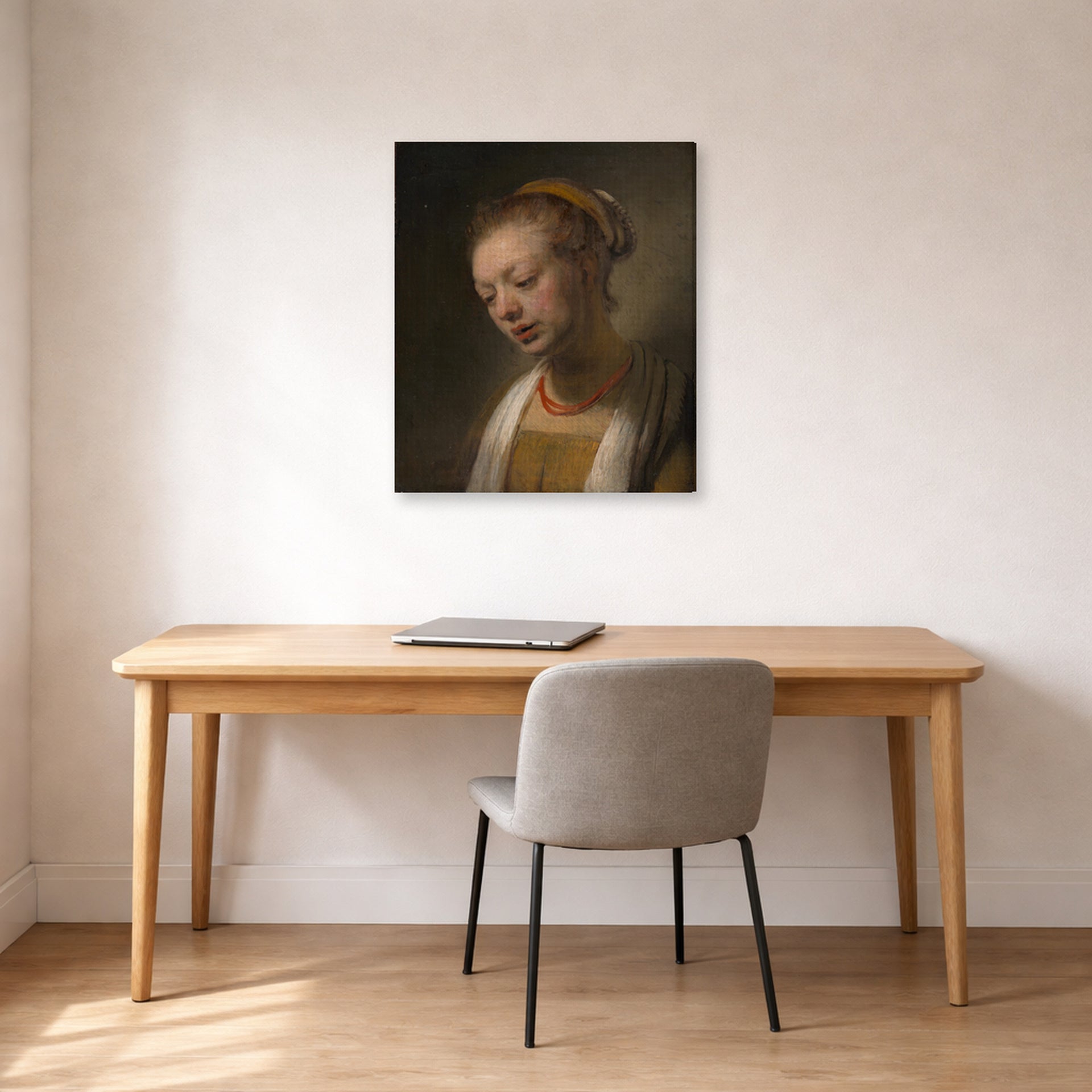 Gallery-wrapped canvas print of Rembrandt's Young Woman with a Red Necklace displayed on a wall in an office