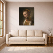 Unframed poster print of Rembrandt's Young Woman with a Red Necklace displayed on a wall in a living room