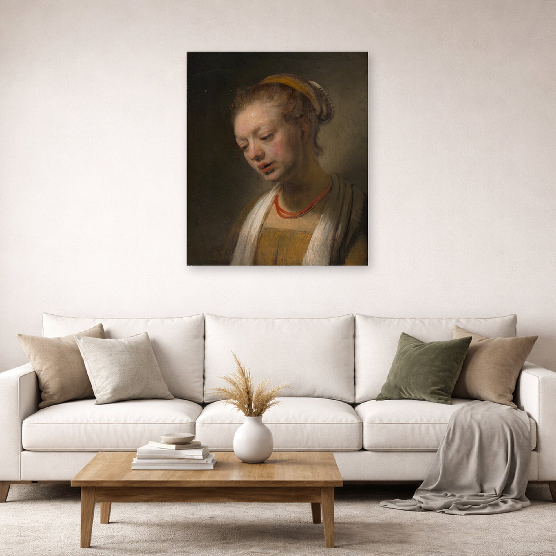 Unframed poster print of Rembrandt's Young Woman with a Red Necklace displayed on a wall in a living room