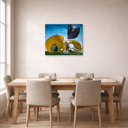 Gallery-wrapped canvas print of Salvador Dali's Birth of Liquid Desires displayed on a wall in a dining room