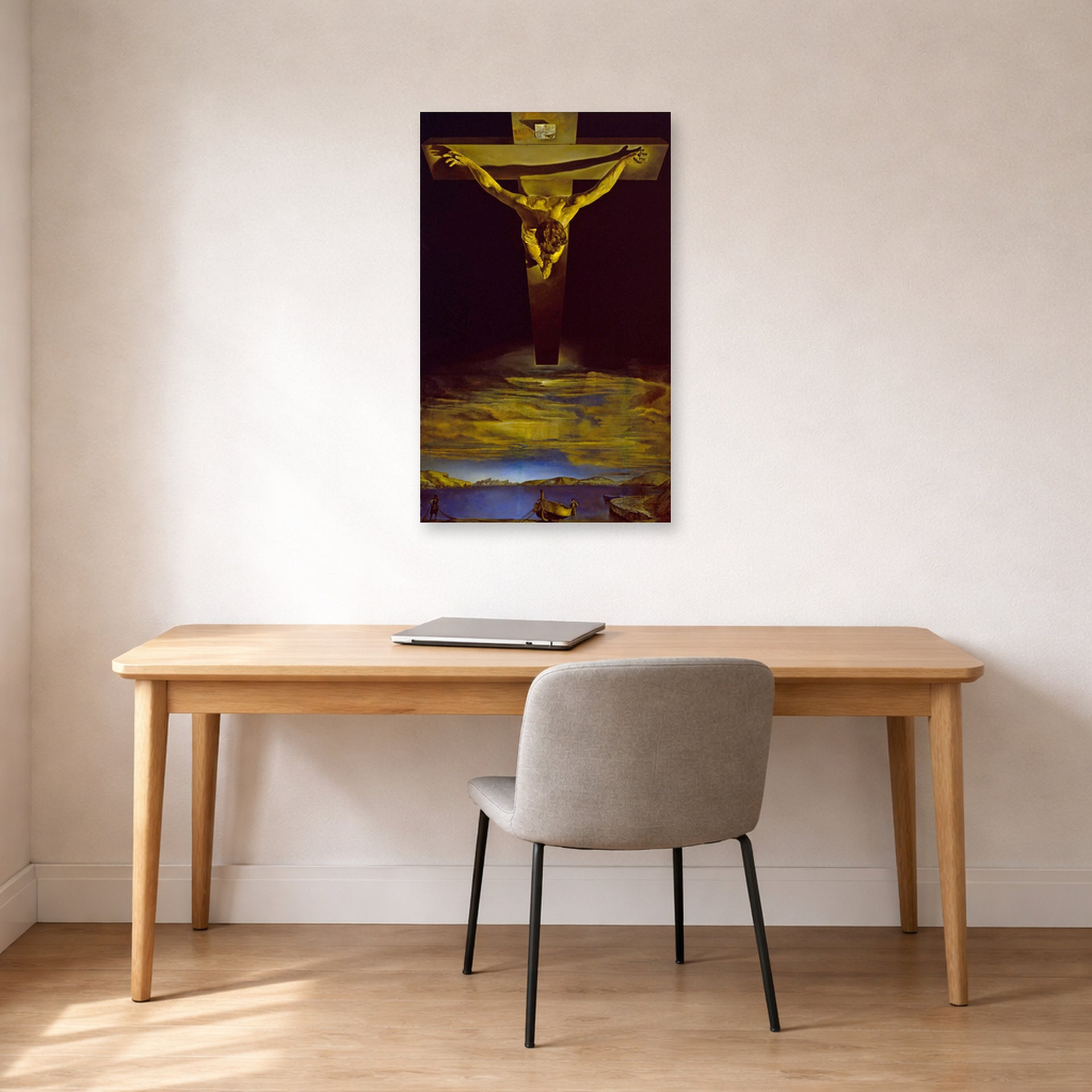 Unframed poster print of Salvador Dali's Christ of St. John of the Cross displayed on a wall in a office