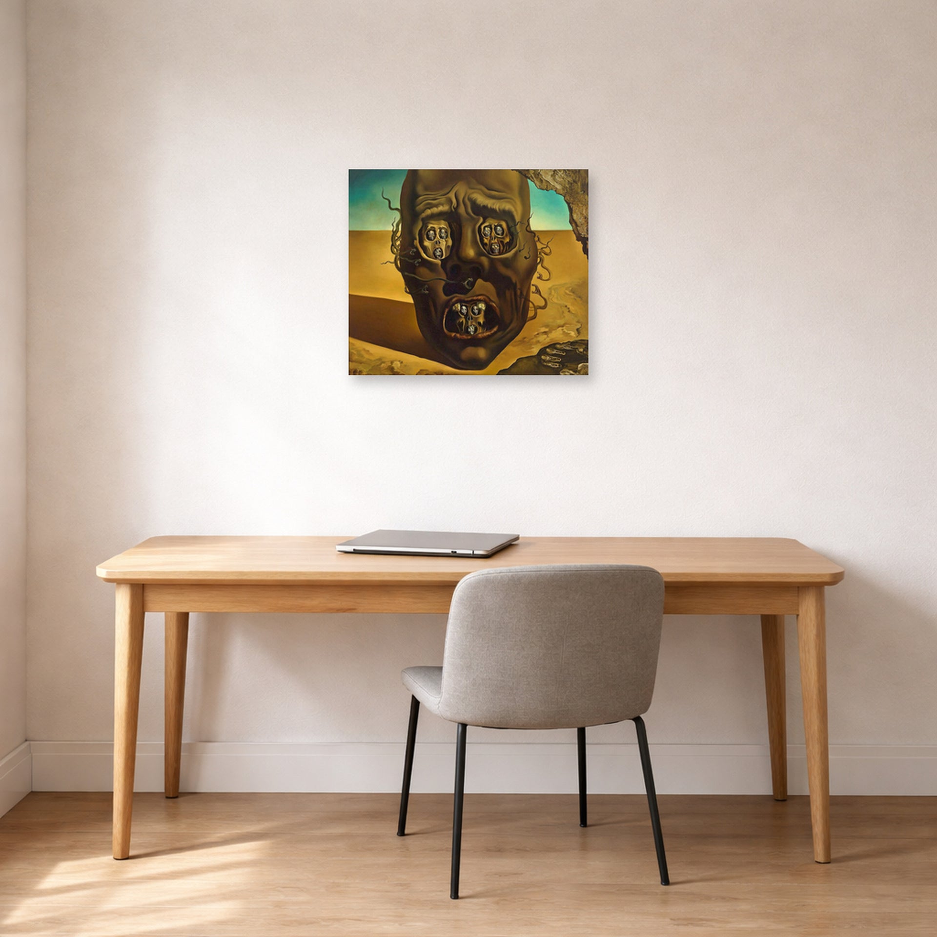 Unframed poster print of Salvador Dali's Face of War displayed on a wall in a office