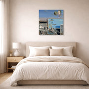 Gallery-wrapped canvas print of Salvador Dali's Illumined Pleasures displayed on a wall in a bedroom
