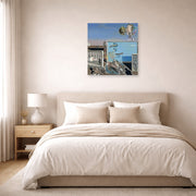 Unframed poster print of Salvador Dali's Illumined Pleasures displayed on a wall in a bedroom