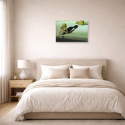 Unframed poster print of Salvador Dali's Remorse or Sphinx Embedded in the Sand displayed on a wall in a bedroom