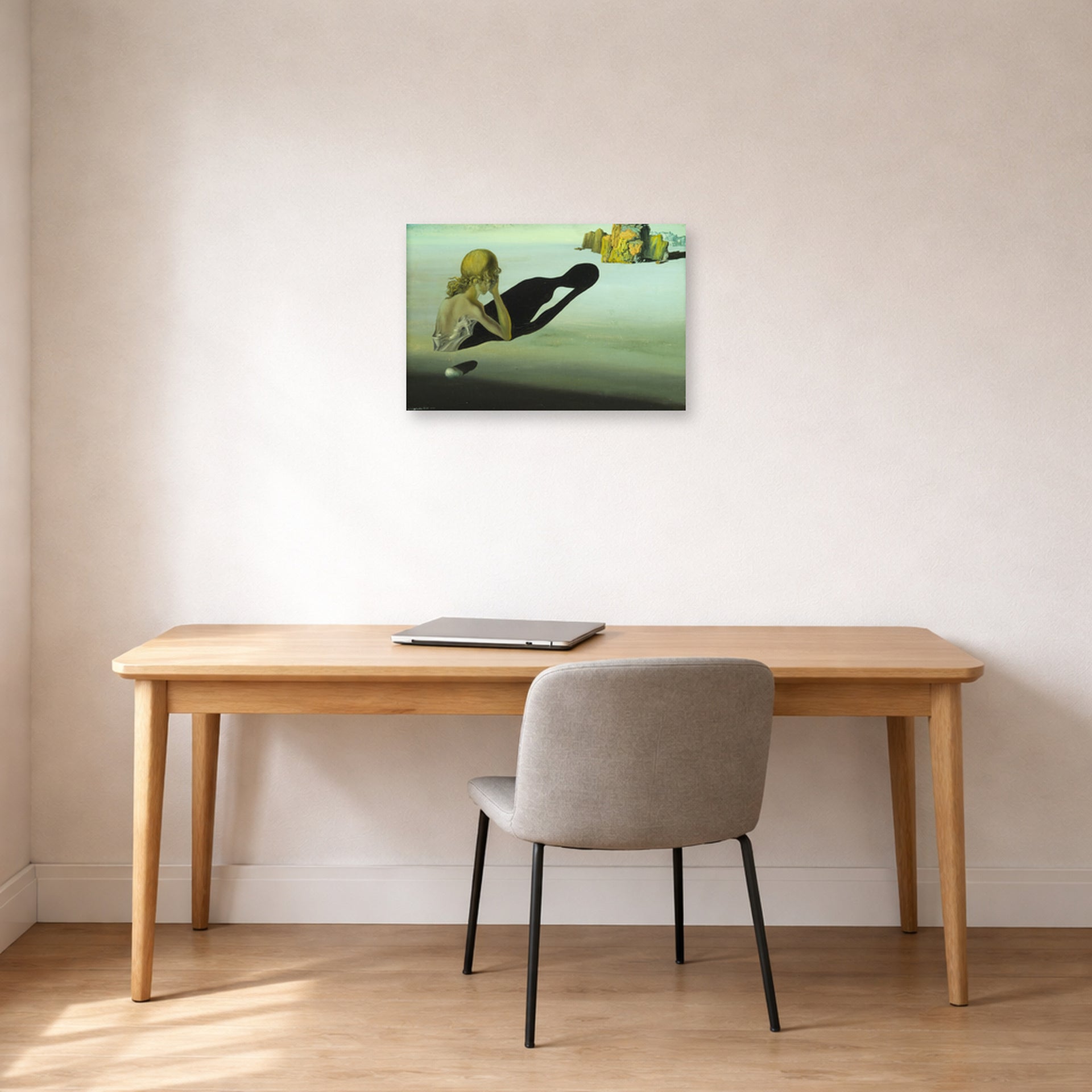 Unframed poster print of Salvador Dali's Remorse or Sphinx Embedded in the Sand displayed on a wall in a office
