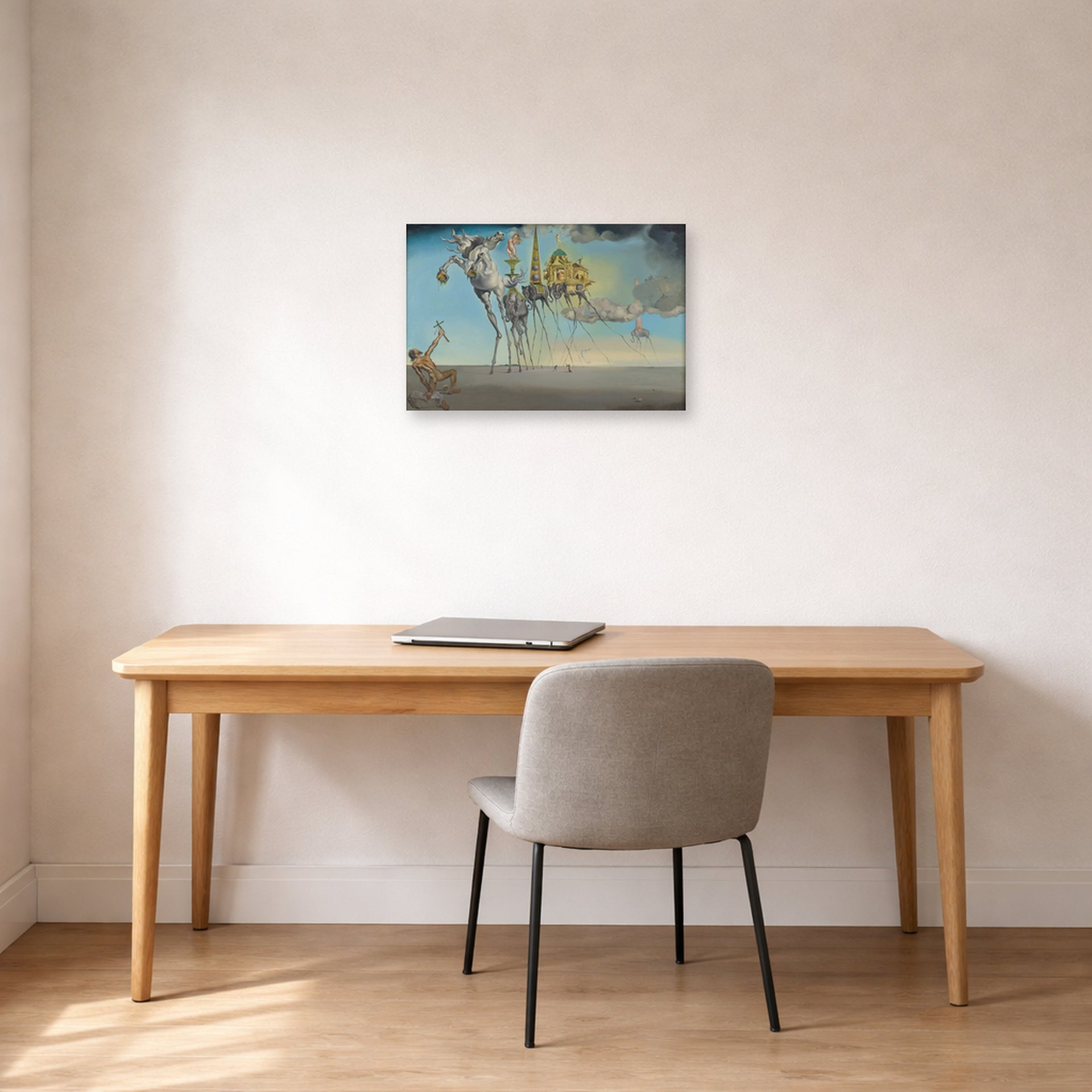 Unframed poster print of Salvador Dali's The Temptation of St. Anthony displayed on a wall in a office