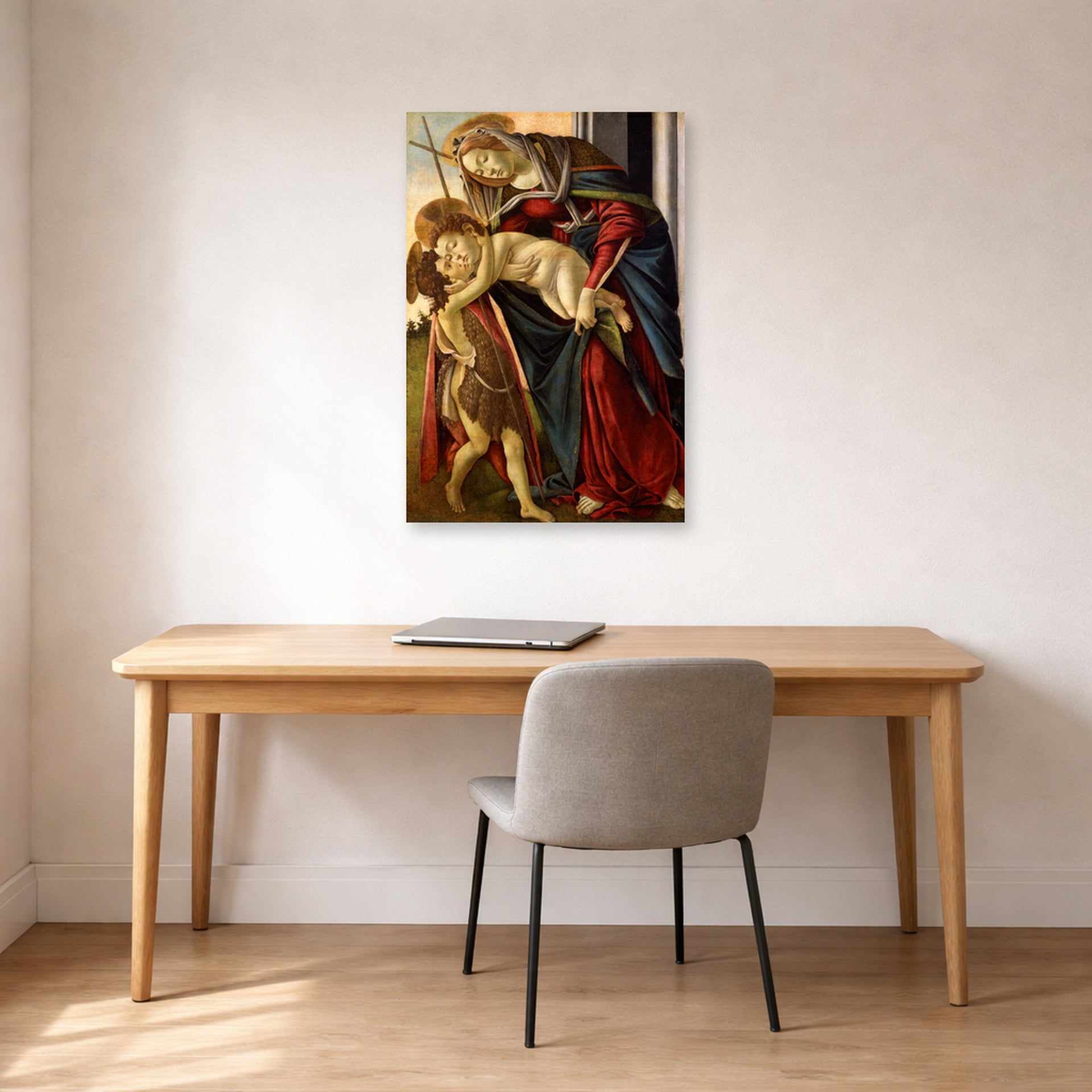 Unframed poster print of Sandro Botticelli's Madonna and Child with John the Baptist displayed on a wall in an office