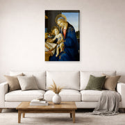 Gallery-wrapped canvas print of Sandro Botticelli's Madonna of the Book displayed on a wall in a living room