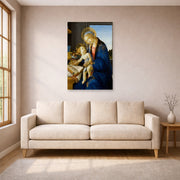 Unframed poster print of Sandro Botticelli's Madonna of the Book displayed on a wall in a living room