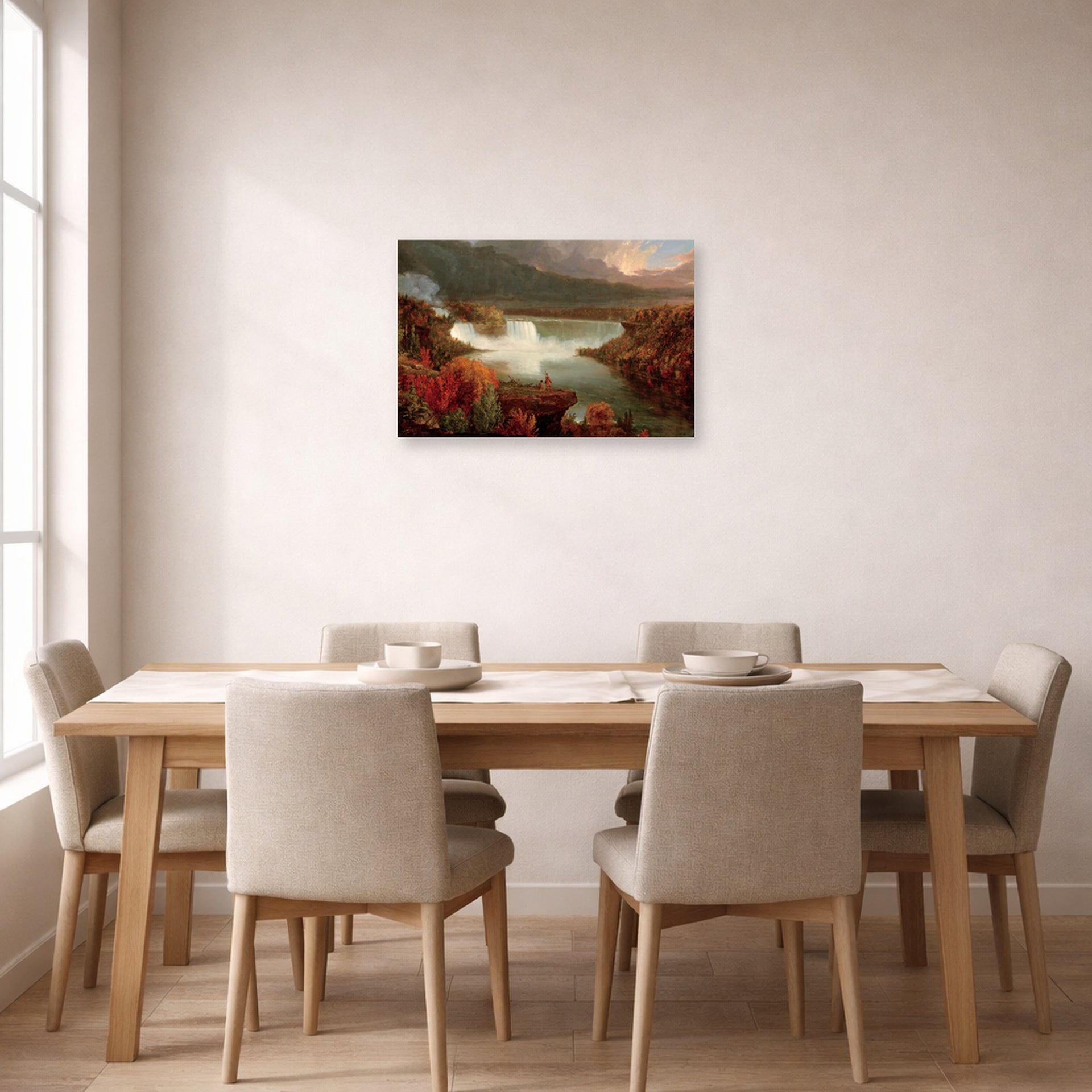 Unframed poster print of Thomas Cole's Distant View of Niagara Falls displayed on a wall in a dining room