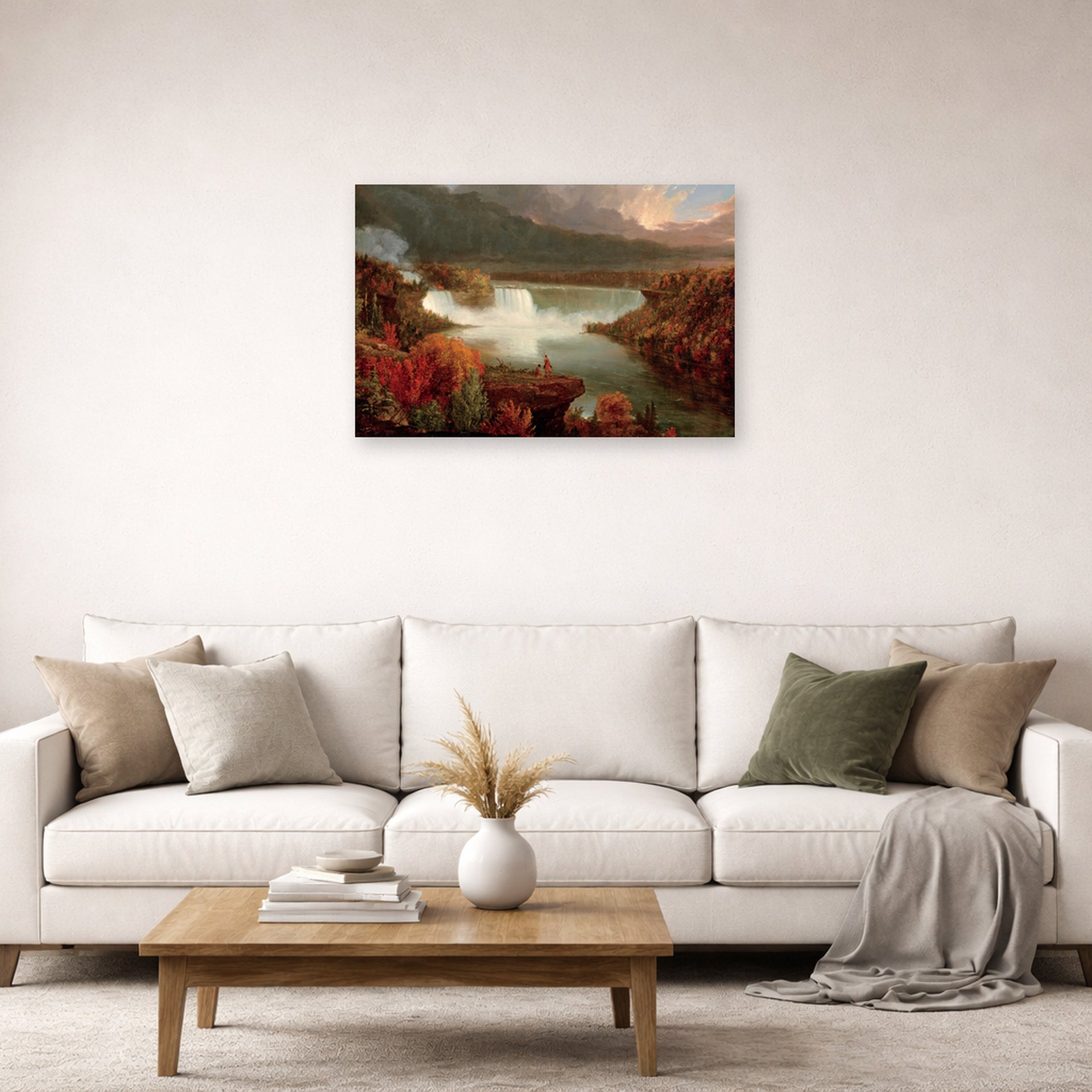 Unframed poster print of Thomas Cole's Distant View of Niagara Falls displayed on a wall in a living room