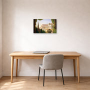 Unframed poster print of Thomas Cole's The Architect's Dream displayed on a wall in a office