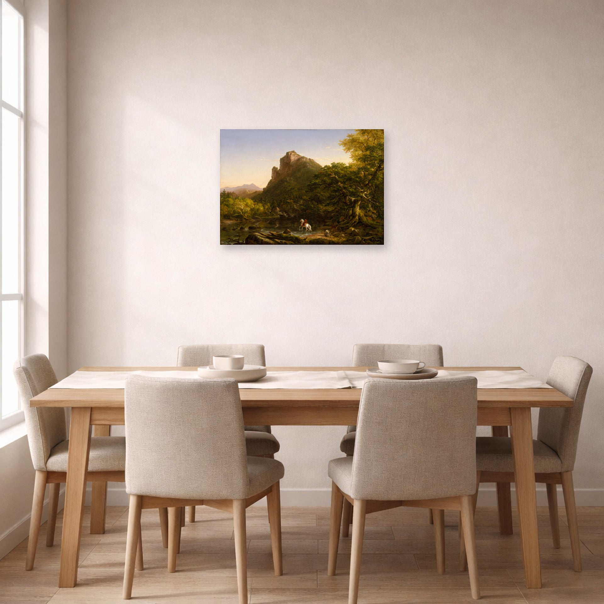 Unframed poster print of Thomas Cole's The Mountain Ford displayed on a wall in a dining room