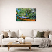 Gallery-wrapped canvas print of Vincent van Gogh's Bank of the Oise at Auvers displayed on a wall in a living room