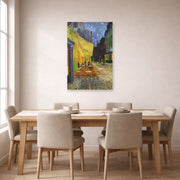 Unframed poster print of Vincent van Gogh's Cafe Terrace at Night displayed on a wall in a dining room