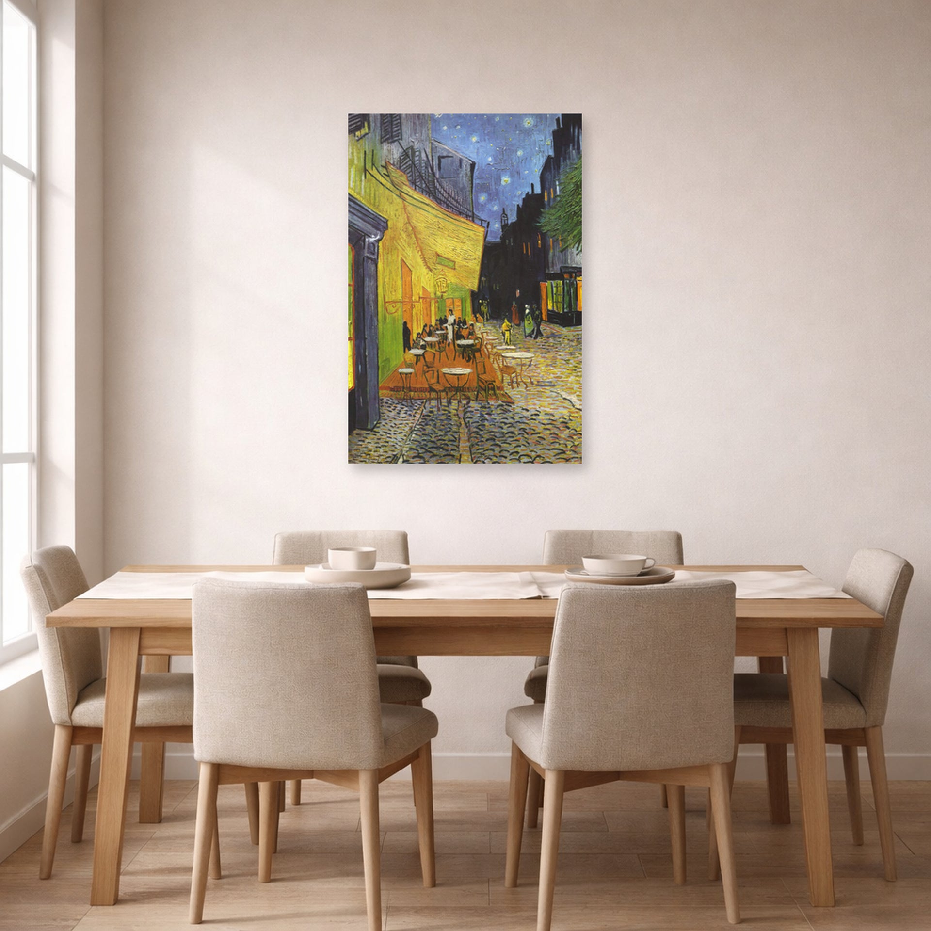 Unframed poster print of Vincent van Gogh's Cafe Terrace at Night displayed on a wall in a dining room