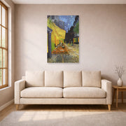 Unframed poster print of Vincent van Gogh's Cafe Terrace at Night displayed on a wall in a living room