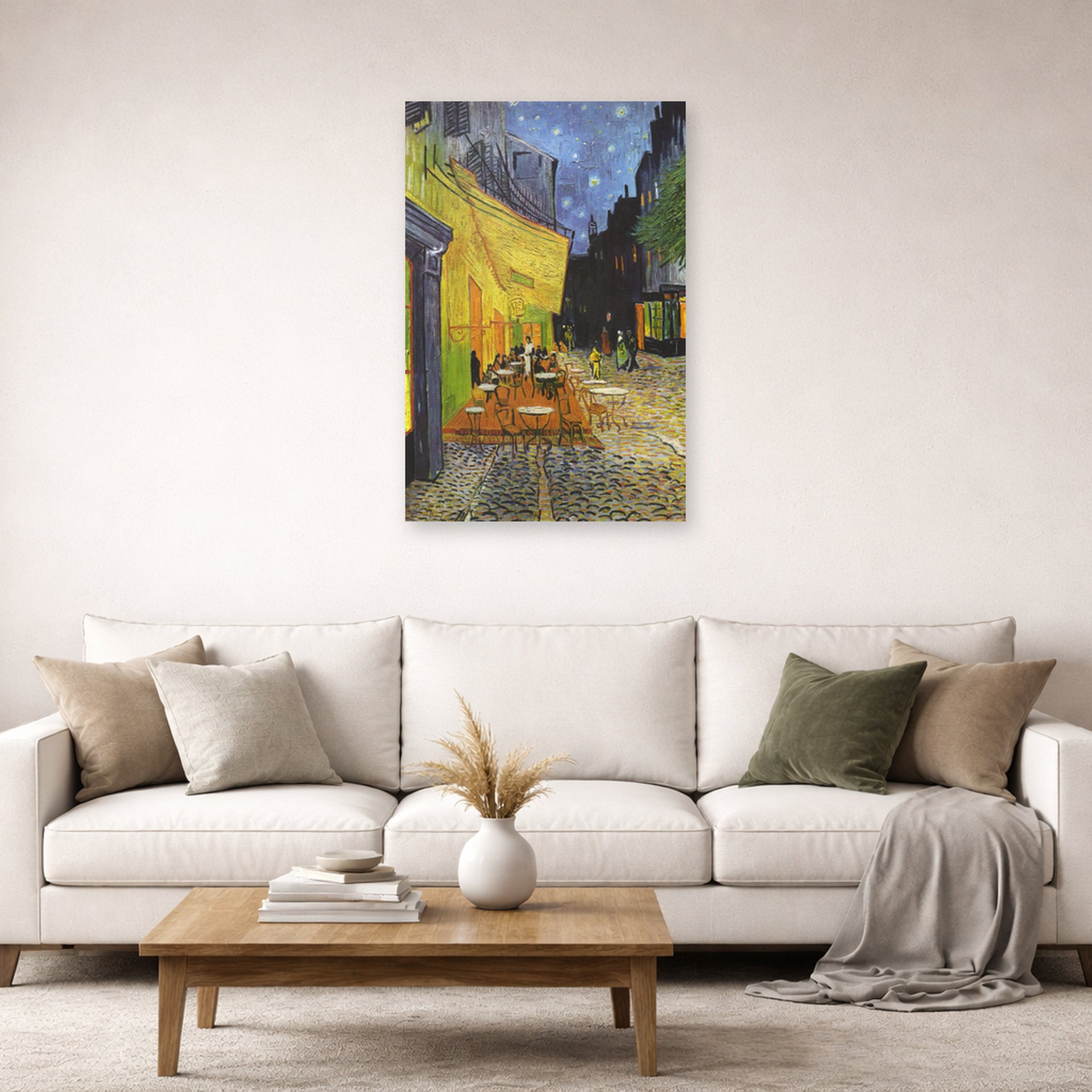Unframed poster print of Vincent van Gogh's Cafe Terrace at Night displayed on a wall in a living room