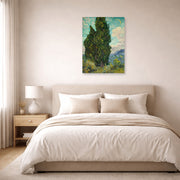 Unframed poster print of Vincent van Gogh's Cypresses displayed on a wall in a bedroom