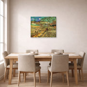 Gallery-wrapped canvas print of Vincent van Gogh's Enclosed Wheat Field with Peasant displayed on a wall in a dining room