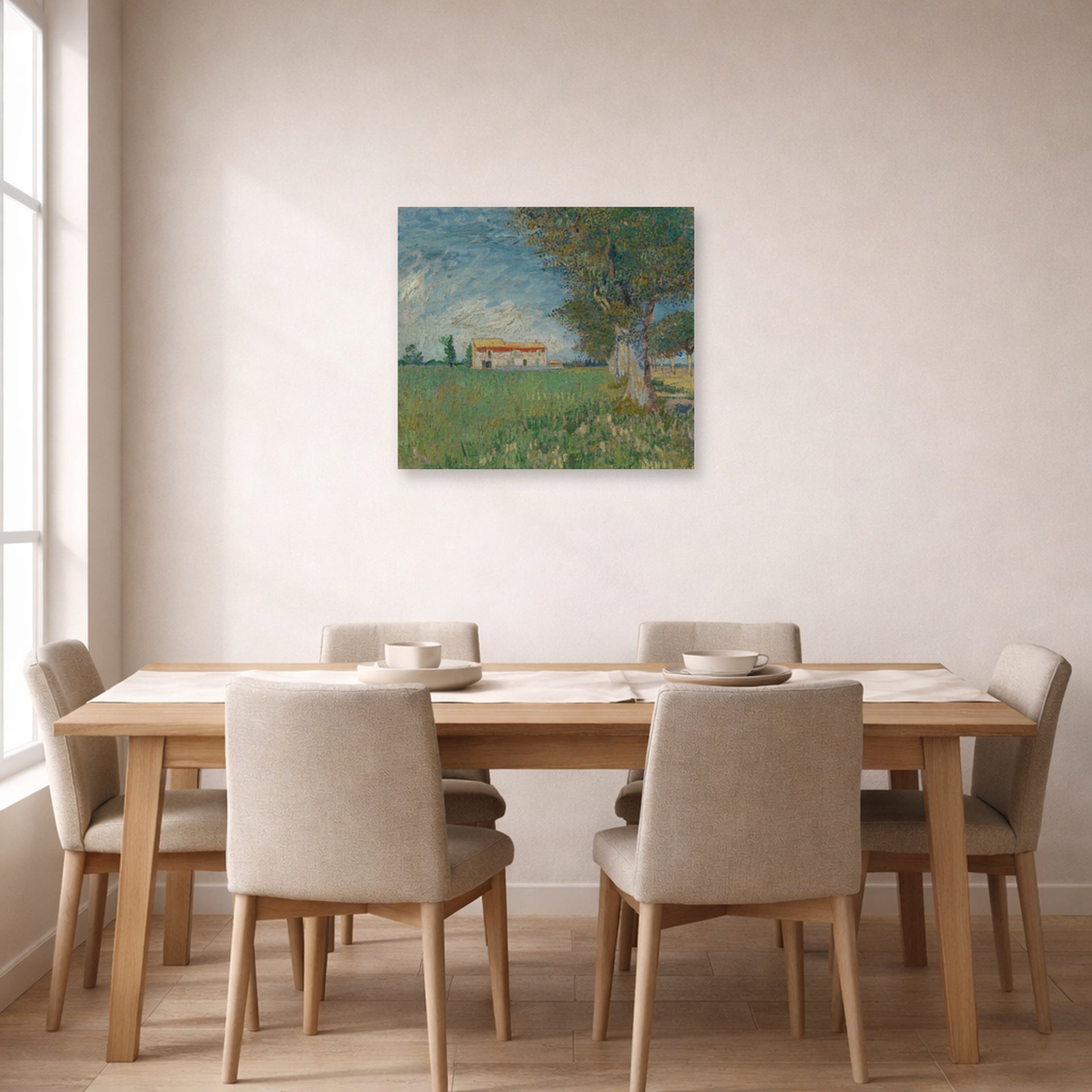 Unframed poster print of Vincent van Gogh's Farmhouse in a Wheatfield displayed on a wall in a dining room