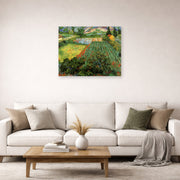 Unframed poster print of Vincent van Gogh's Field with Poppies displayed on a wall in a living room