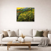 Unframed poster print of Vincent van Gogh's Field of Spring Wheat at Sunrise displayed on a wall in a living room