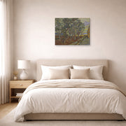 Gallery-wrapped canvas print of Vincent van Gogh's Garden of the Asylum displayed on a wall in a bedroom