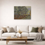 Gallery-wrapped canvas print of Vincent van Gogh's Garden of the Asylum displayed on a wall in a living room