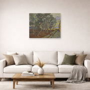Unframed poster print of Vincent van Gogh's Garden of the Asylum displayed on a wall in a living room