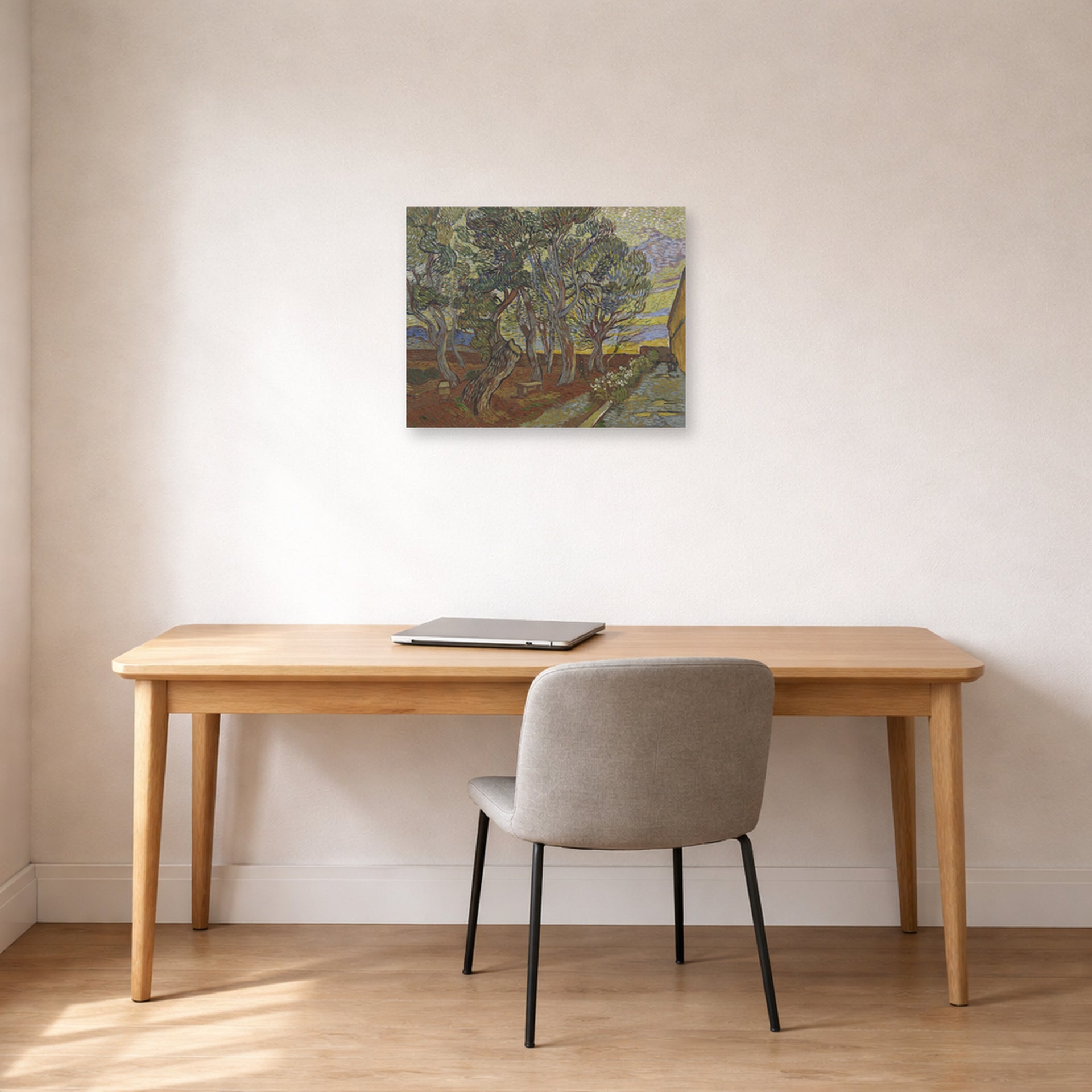 Unframed poster print of Vincent van Gogh's Garden of the Asylum displayed on a wall in a home office