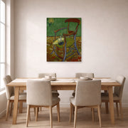 Unframed poster print of Vincent van Gogh's Gauguin's Chair displayed on a wall in a dining room