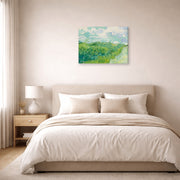 Gallery-wrapped canvas print of Vincent van Gogh's Green Wheat Fields, Auvers displayed on a wall in a bedroom