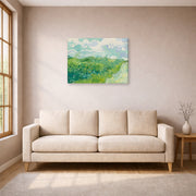 Gallery-wrapped canvas print of Vincent van Gogh's Green Wheat Fields, Auvers displayed on a wall in a living room