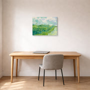 Gallery-wrapped canvas print of Vincent van Gogh's Green Wheat Fields, Auvers displayed on a wall in a home office