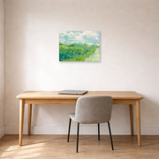 Unframed poster print of Vincent van Gogh's Green Wheat Fields, Auvers displayed on a wall in a home office
