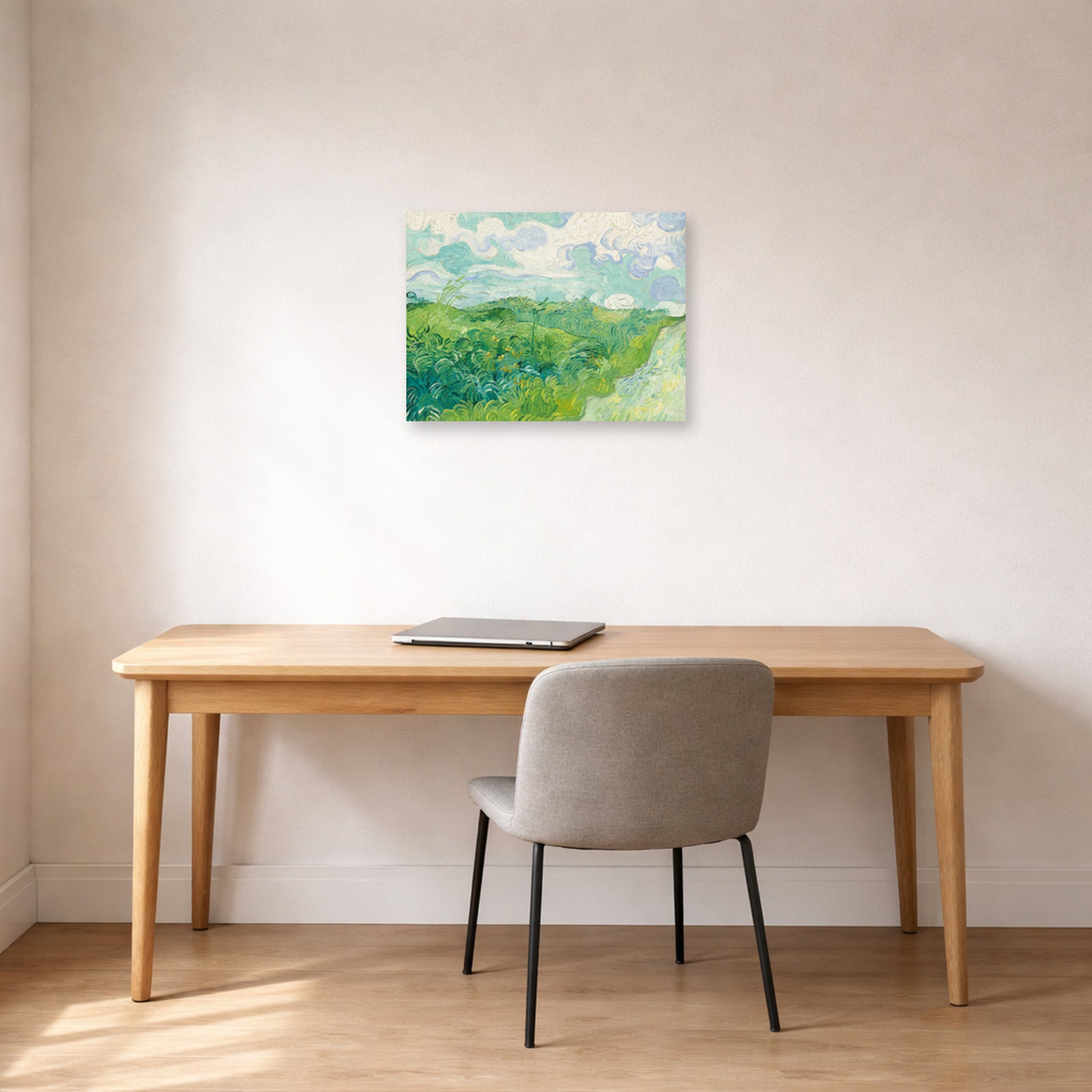 Unframed poster print of Vincent van Gogh's Green Wheat Fields, Auvers displayed on a wall in a home office