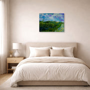 Gallery-wrapped canvas print of Vincent van Gogh's Green Wheat Fields displayed on a wall in a bedroom