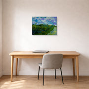 Gallery-wrapped canvas print of Vincent van Gogh's Green Wheat Fields displayed on a wall in a home office