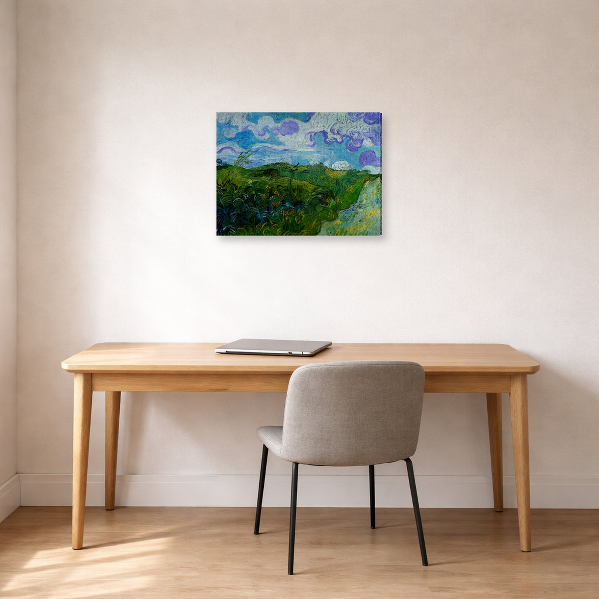 Gallery-wrapped canvas print of Vincent van Gogh's Green Wheat Fields displayed on a wall in a home office