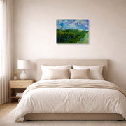 Unframed poster print of Vincent van Gogh's Green Wheat Fields displayed on a wall in a bedroom