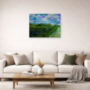 Unframed poster print of Vincent van Gogh's Green Wheat Fields displayed on a wall in a living room